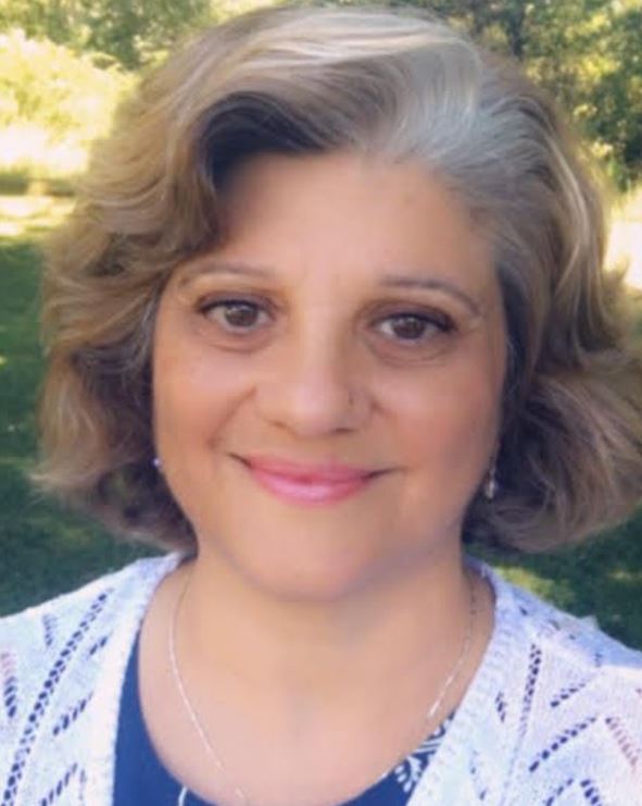 Picture of a woman with short brown hair smiling