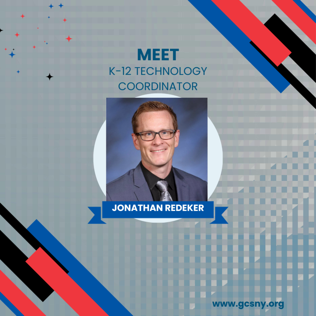 A man wearing glasses and a suit smiles in front of a blue backdrop in a graphic with the text "Meet K-12 Technology Coordinator Jonathan Redeker."