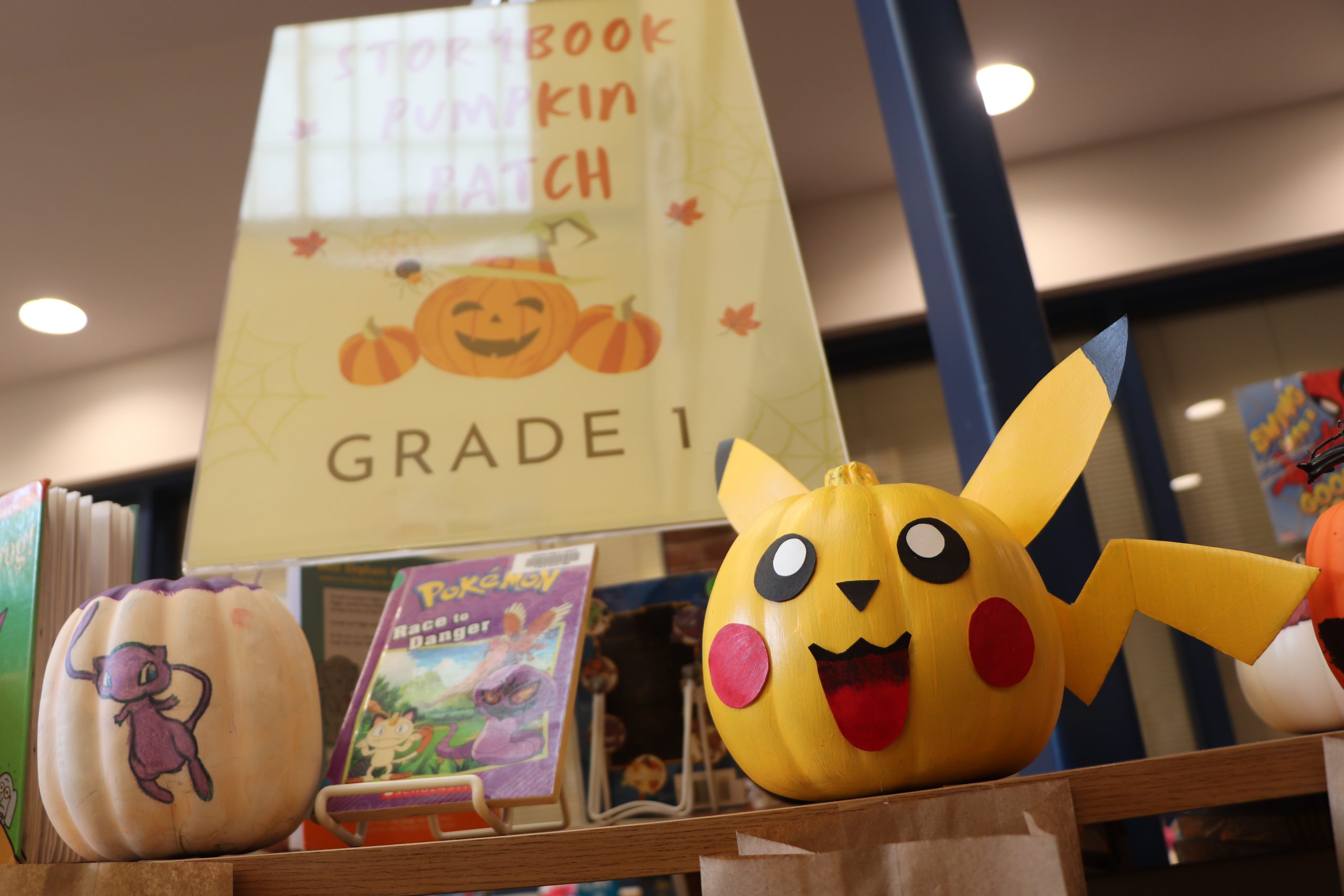 An image of pumpkins decorated like Pikachu and Mew from Pokemon with the text "Storybook Pumpkin Patch Grade 1."