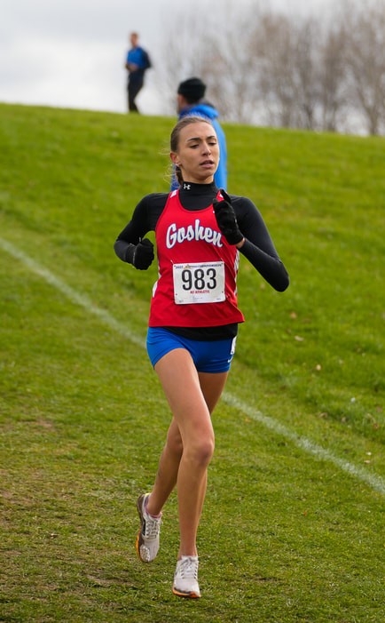 A Goshen High School student runs in a state cross country meet.
