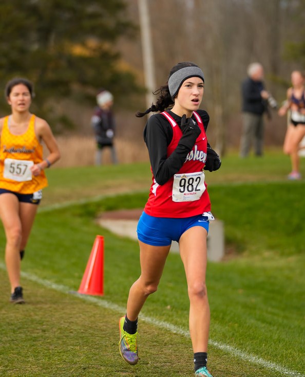 A Goshen High School student runs in a state cross country meet.