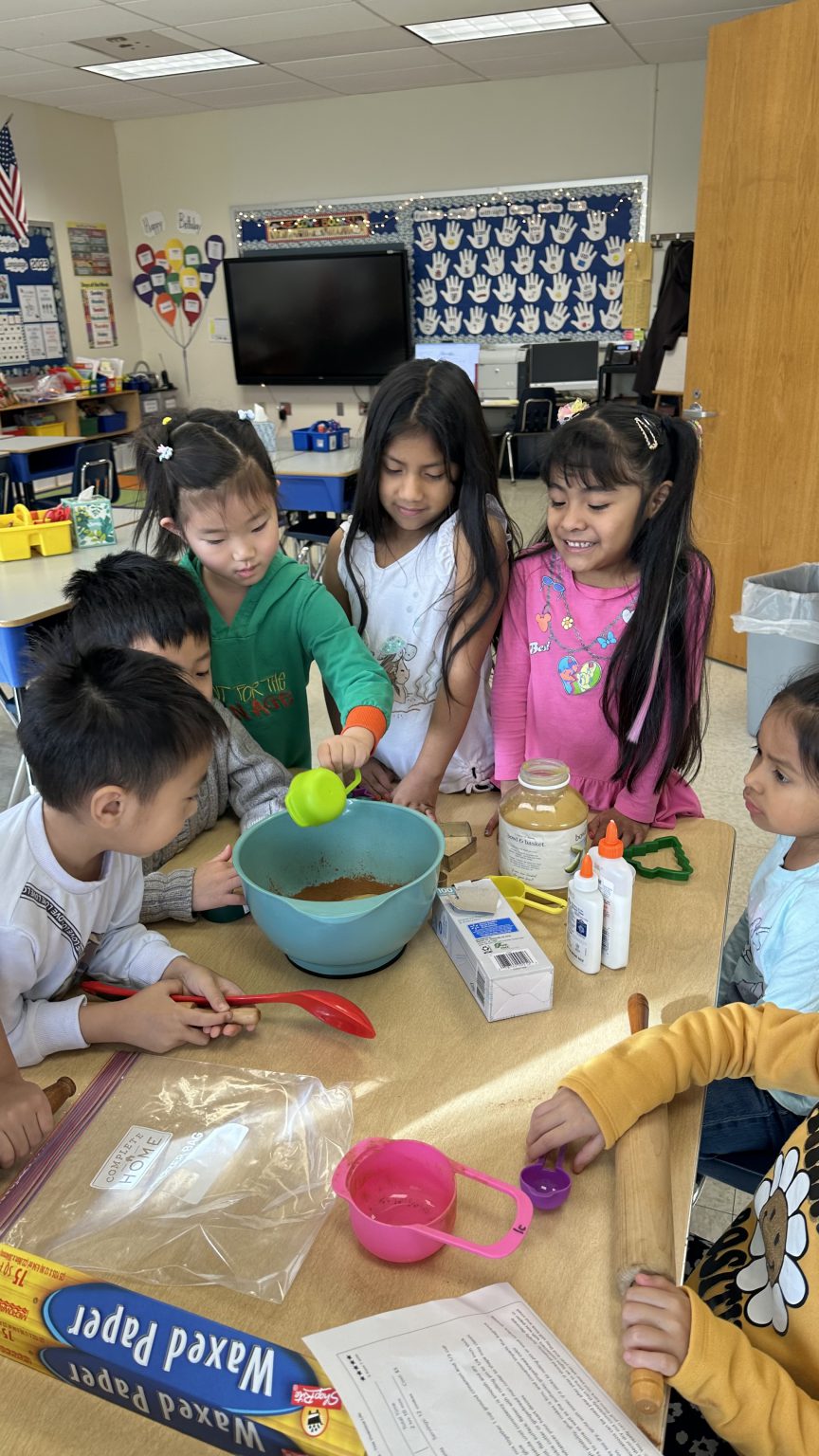 SAS English language learners dive into gingerbread lore and cookies