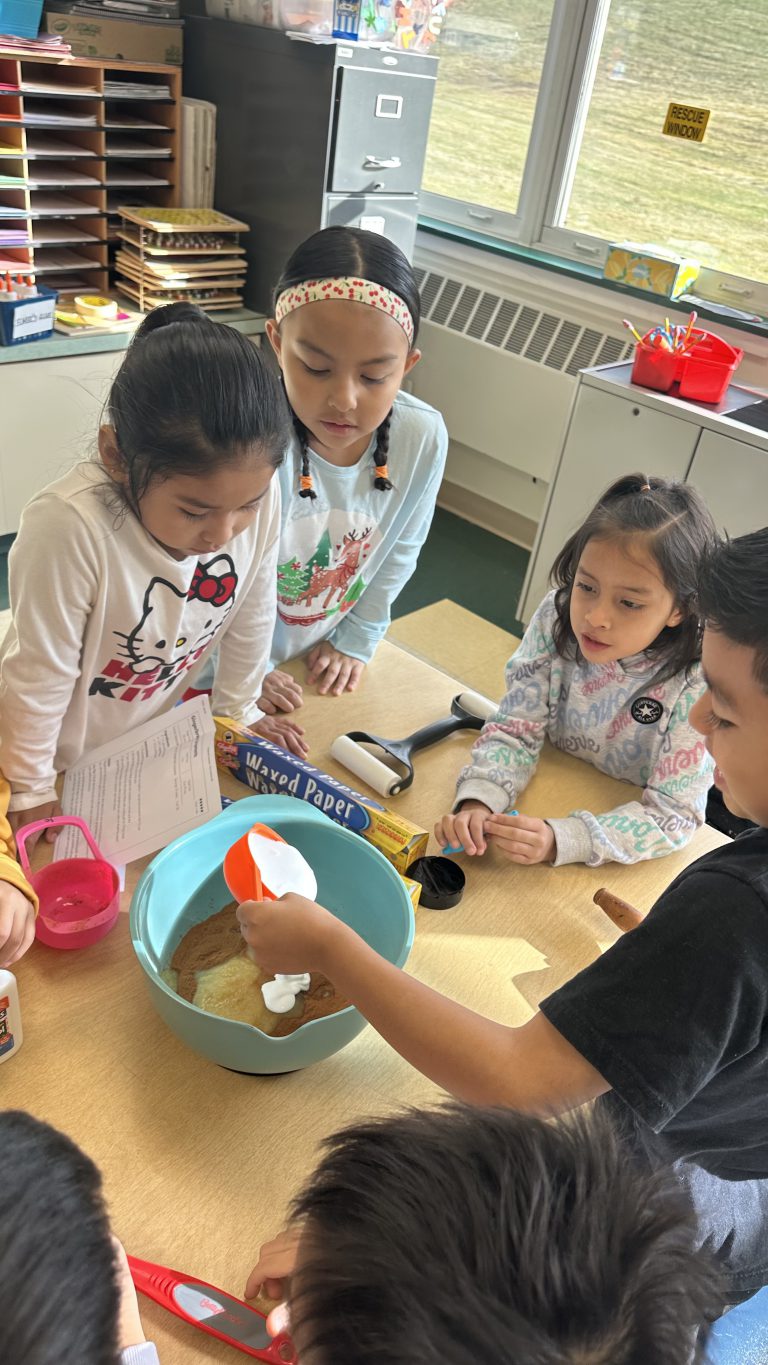 SAS English language learners dive into gingerbread lore and cookies