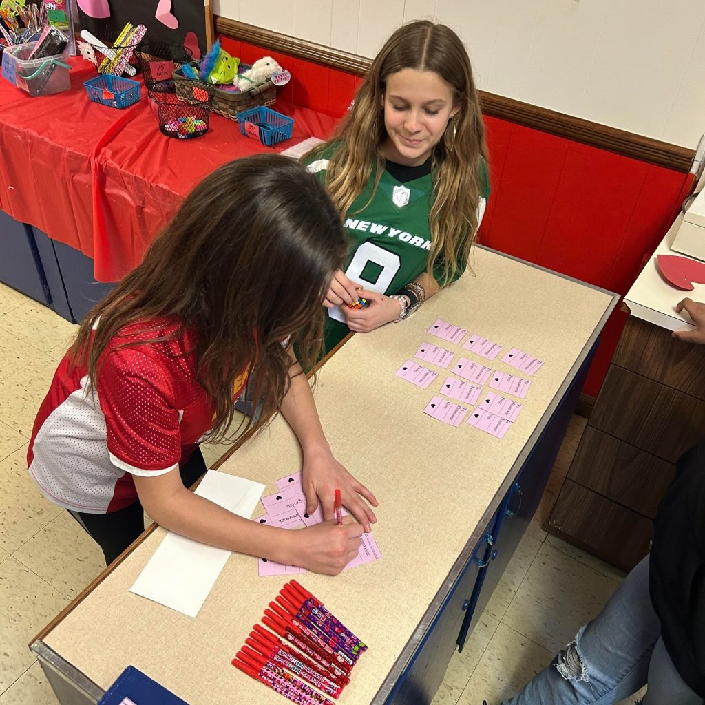 Middle school students write Valentine's Day grams. 