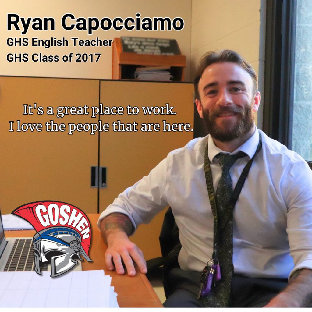 A photo of a Goshen teacher with text on the screen that has his name and title. In the upper left of the photo, it says: Ryan Capocciamo, G.H.S. English Teacher, G.H.S. Class of 2017. The quote says: It's a great place to work. I love the people that are here.