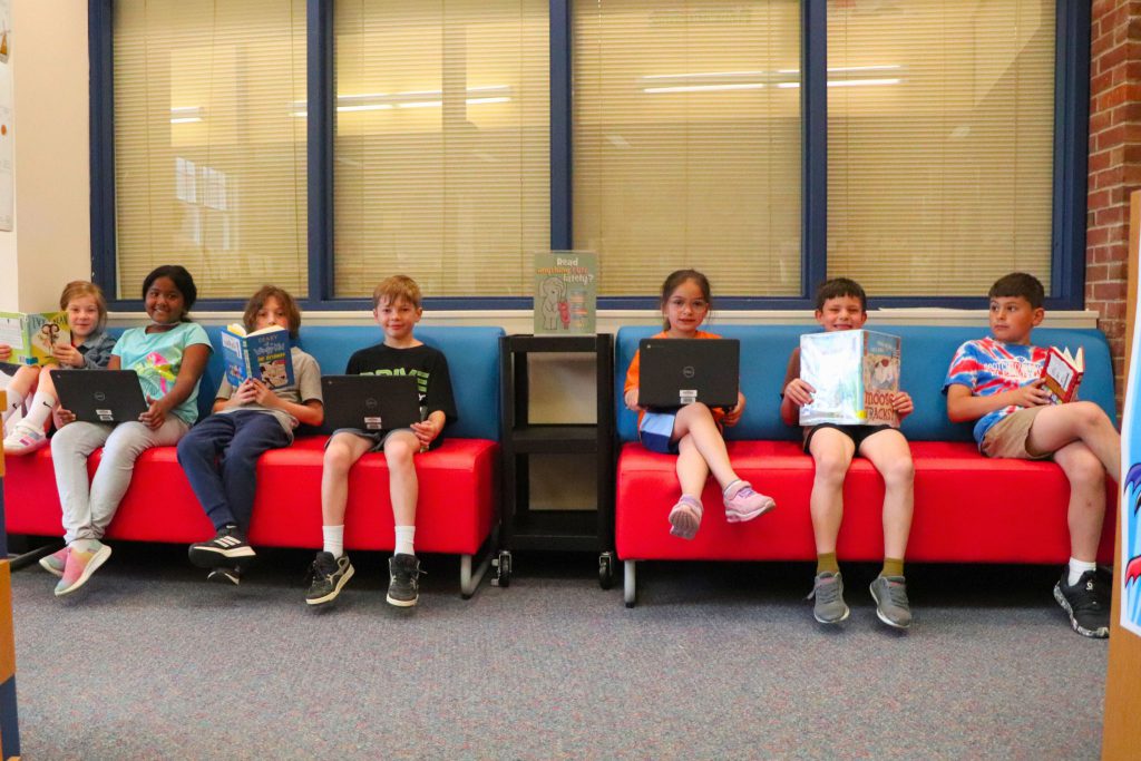 Students enjoy the two new couches in the Scotchtown Avenue School library.