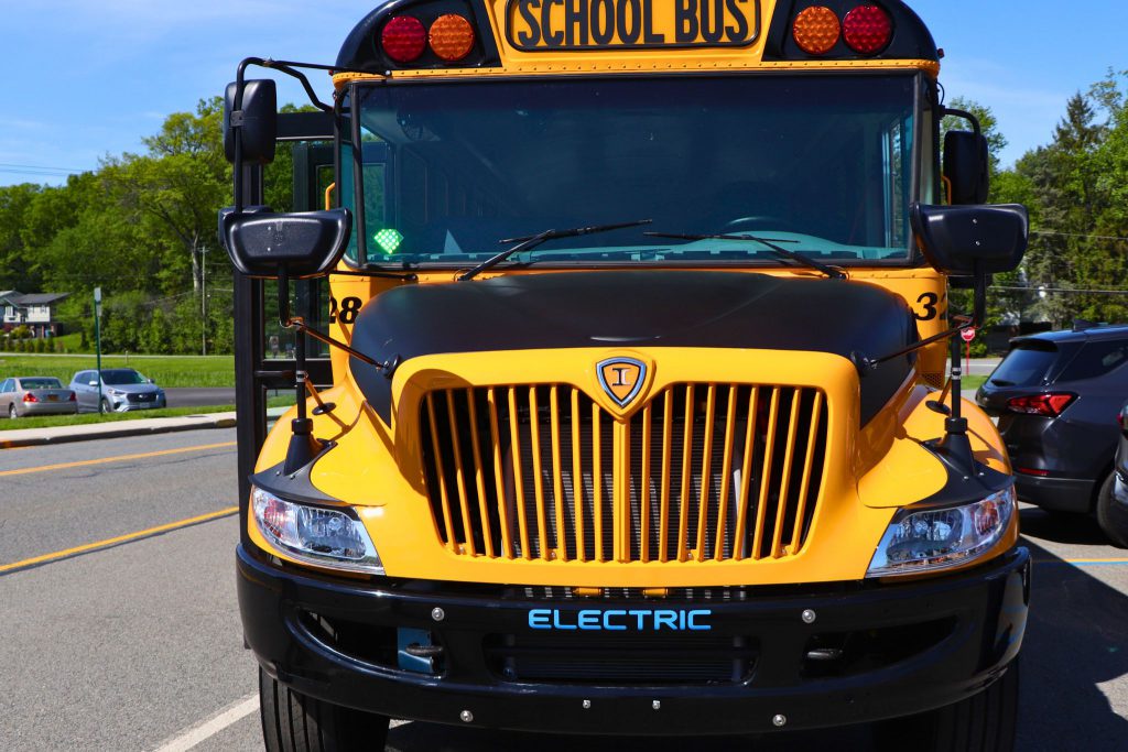 The front of Goshen's new electric bus. The word electric is in the front above where the license plate goes.