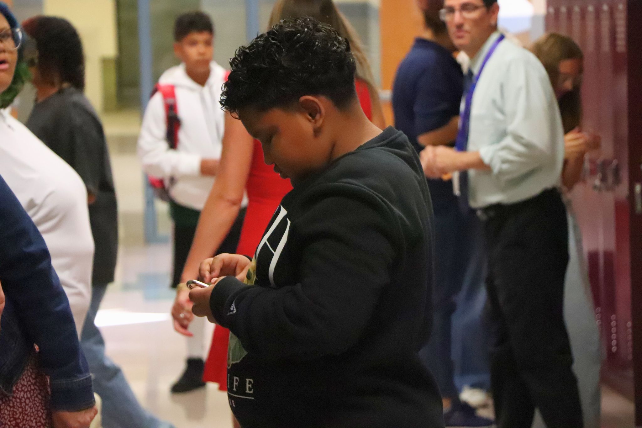 A student tries to open their lock. 