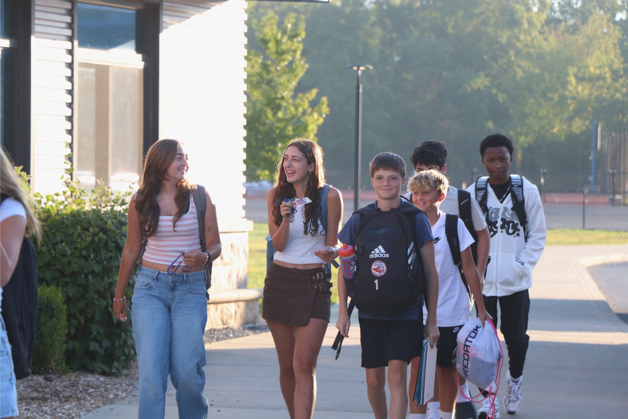 Students walk into school together on the first day of school.