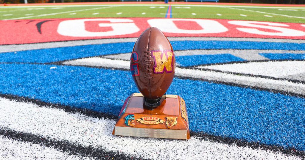 The Spirit Trophy is in the middle of the Goshen football field displaying both teams. 