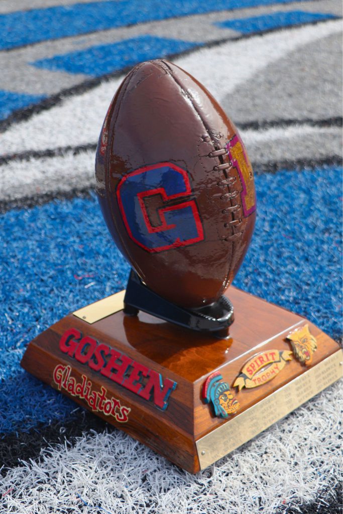 The left side of the Spirit Trophy is the Goshen Gladiators, with the team's name spelled out and a "G" in Goshen blue and red. 