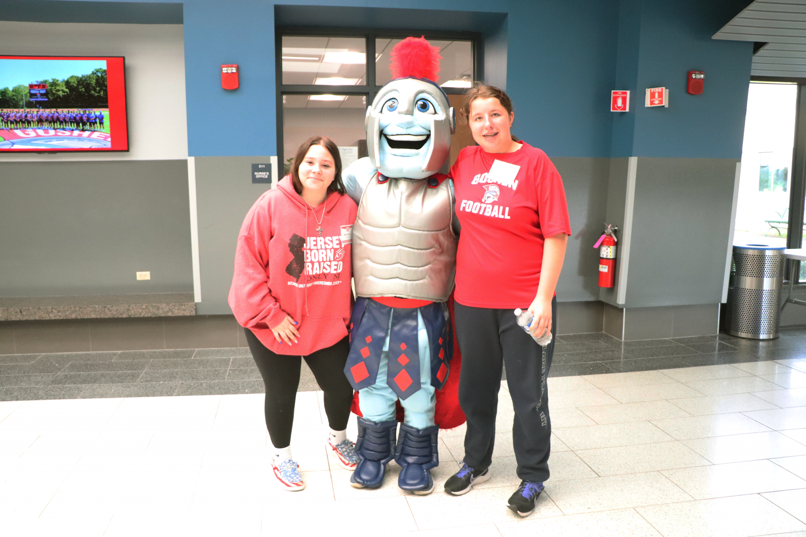 Teens in red with Gladiator mascot