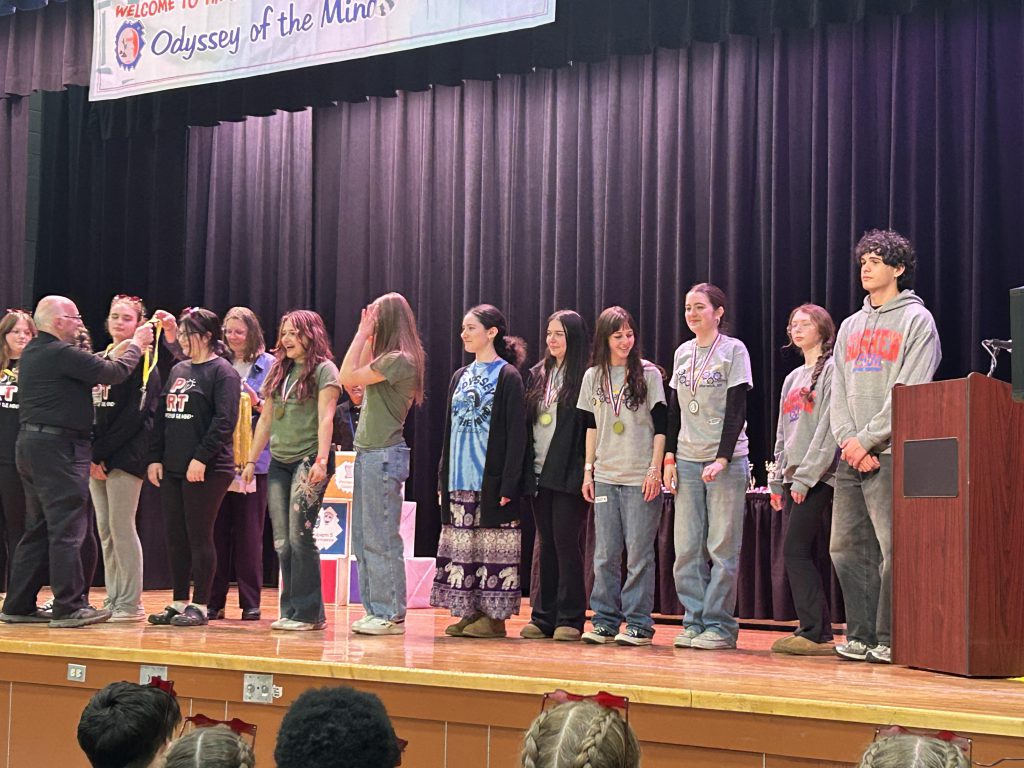 Carly Seligman and Nathan Hulse -seniors being honored for 8 years in OM